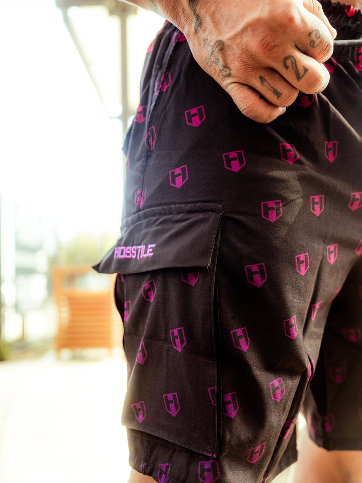 Bodybuilder wearing Echo Cargo Gym Shorts#color_sunset