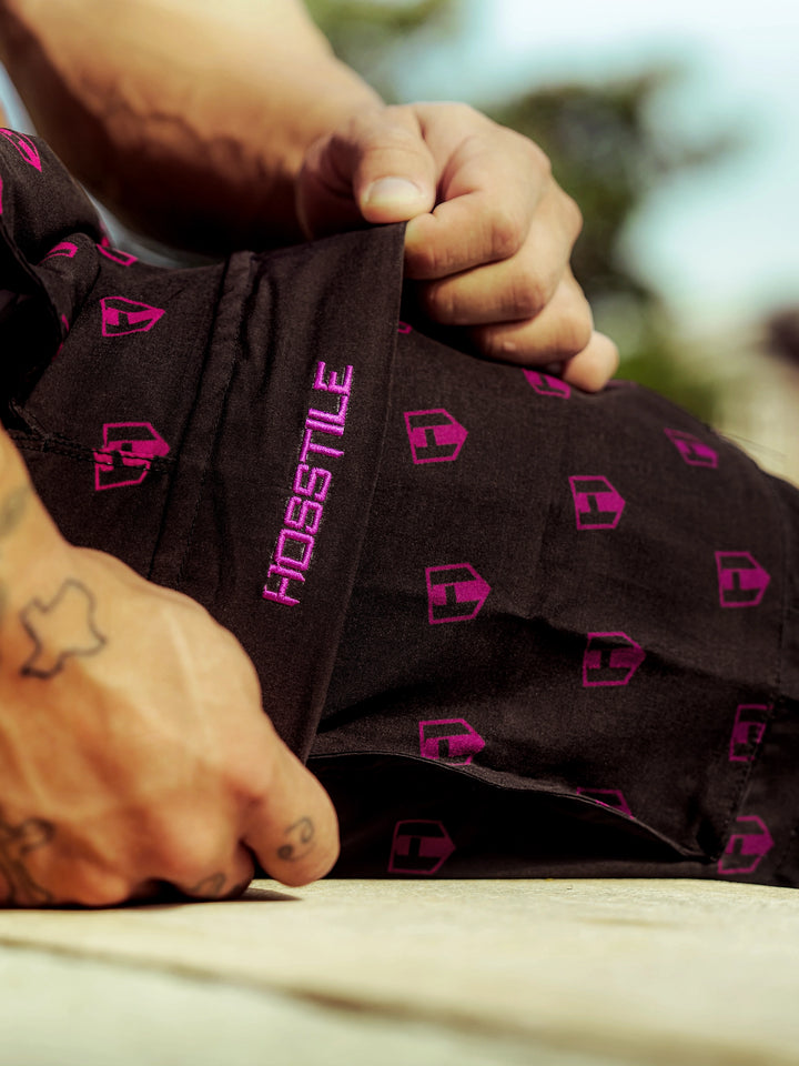 Bodybuilder wearing Echo Cargo Gym Shorts#color_sunset