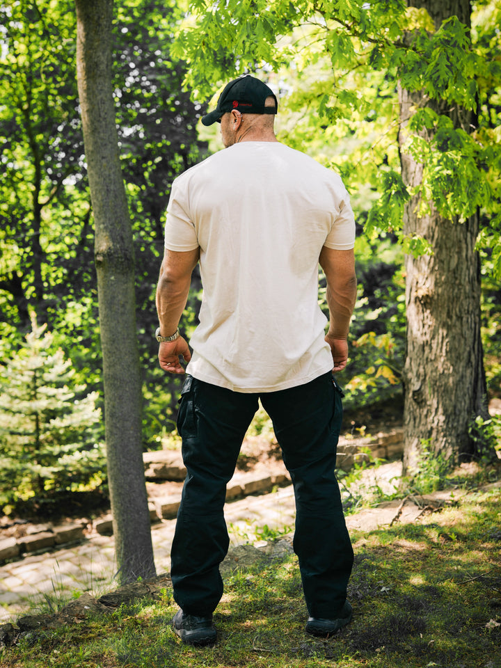 Bodybuilder wearing the Halo Workout Tee#color_sand