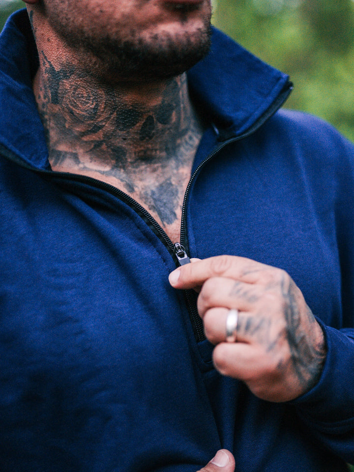 Bodybuilder wearing the Halo Quarter Zip Sweatshirt#color_navy