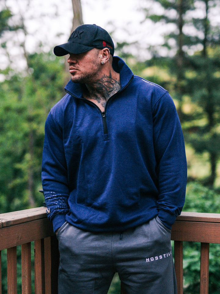Bodybuilder wearing the Halo Quarter Zip Sweatshirt#color_navy