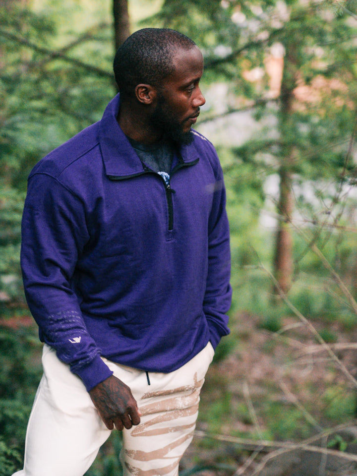 Bodybuilder wearing the Halo Quarter Zip Sweatshirt#color_purple