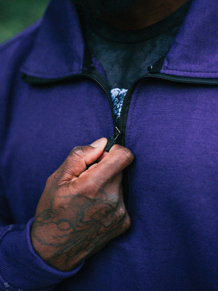 Bodybuilder wearing the Halo Quarter Zip Sweatshirt#color_purple