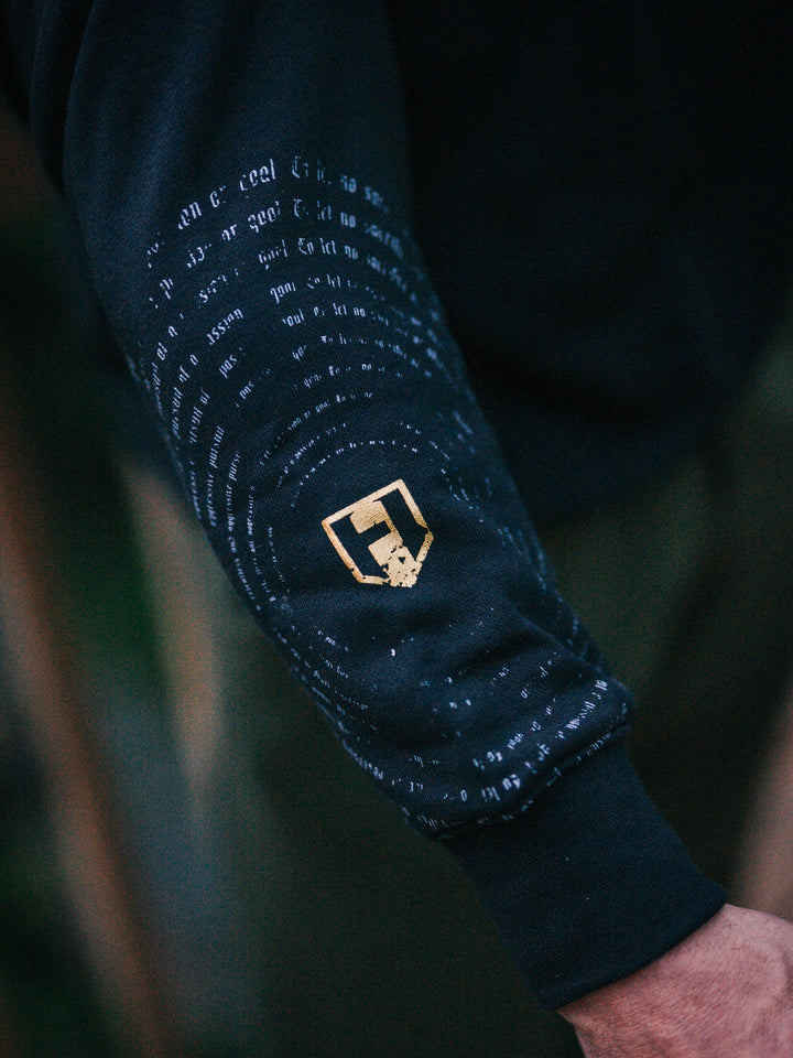 Bodybuilder wearing the Halo Quarter Zip Sweatshirt#color_black