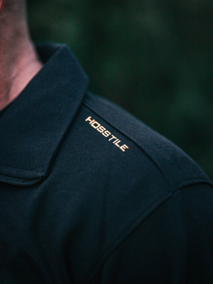 Bodybuilder wearing the Halo Quarter Zip Sweatshirt#color_black