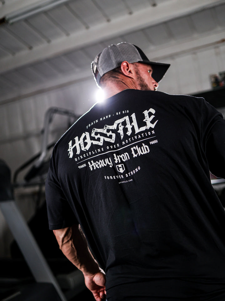 Bodybuilder wearing the Heavy Iron T-Shirt#color_black
