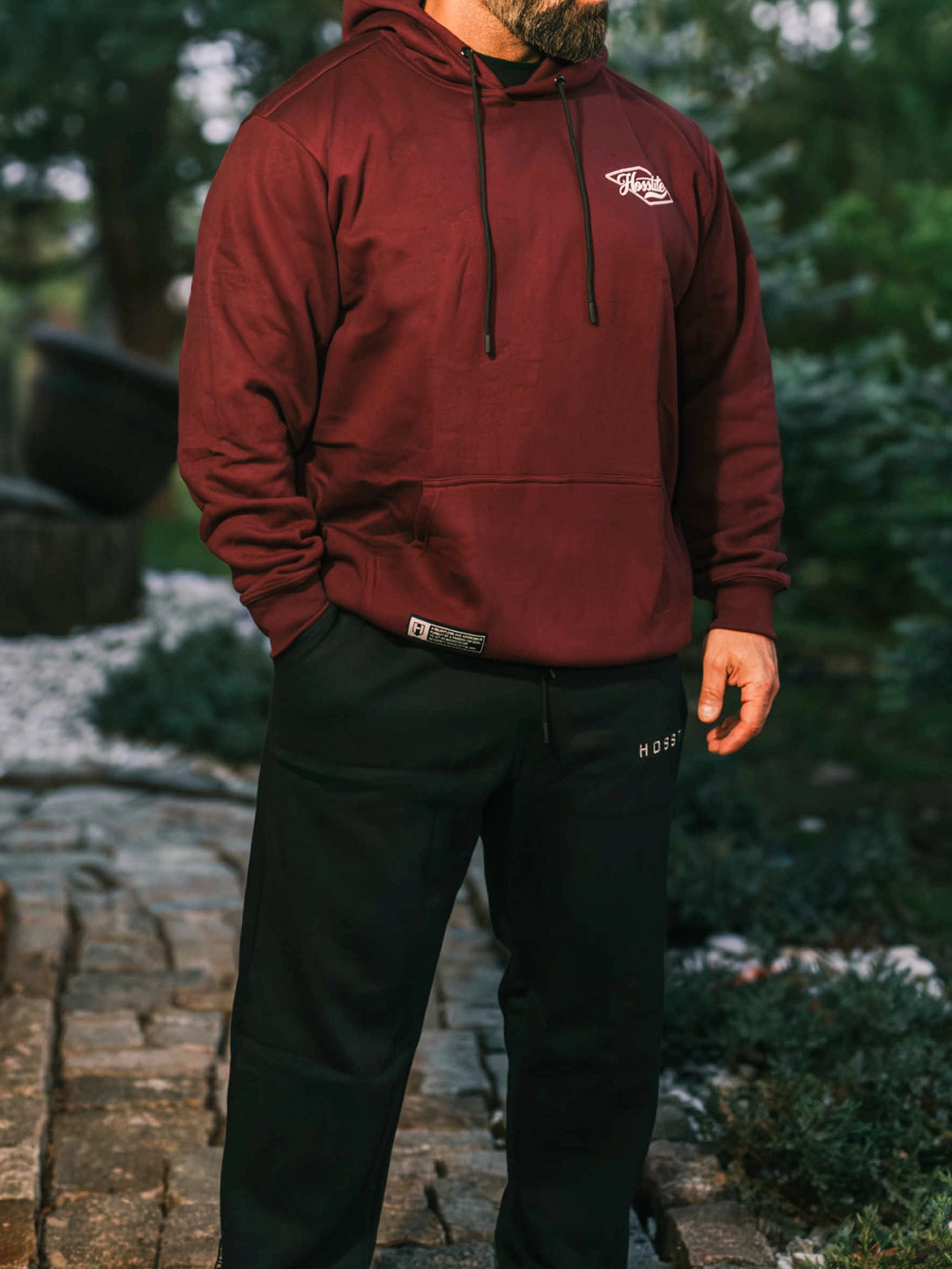 Bodybuilder wearing the Hosstile Straight Leg Jogger#color_black