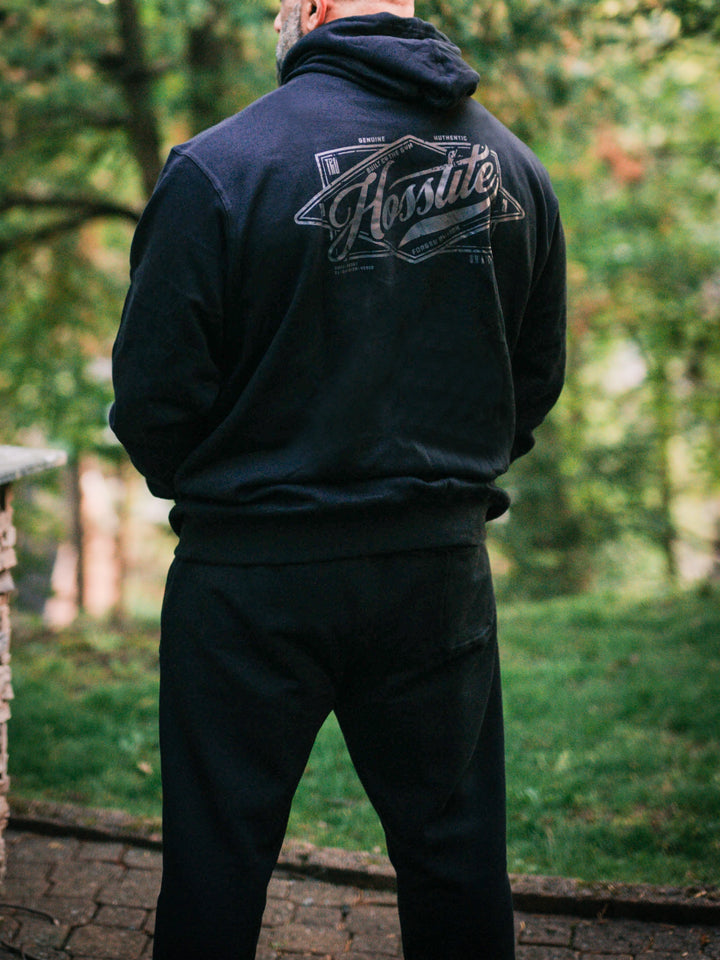 Bodybuilder wearing the Hosstile Straight Leg Jogger#color_black