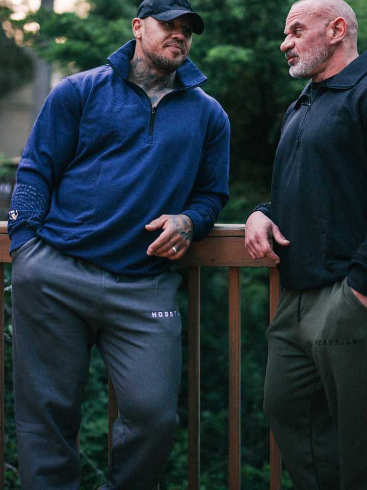 Bodybuilder wearing the Hosstile Straight Leg Jogger#color_grey