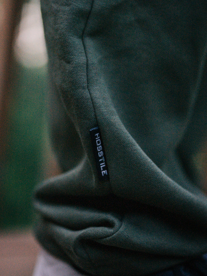 Bodybuilder wearing the Hosstile Straight Leg Jogger#color_military-green