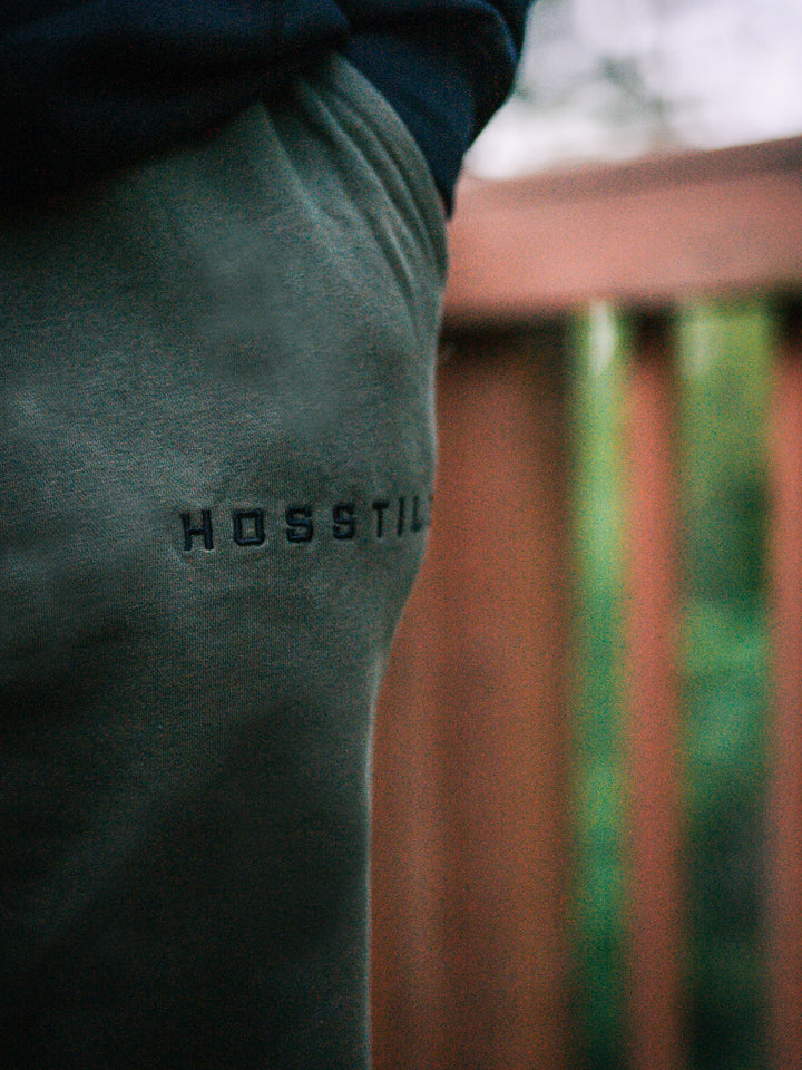 Bodybuilder wearing the Hosstile Straight Leg Jogger#color_military-green