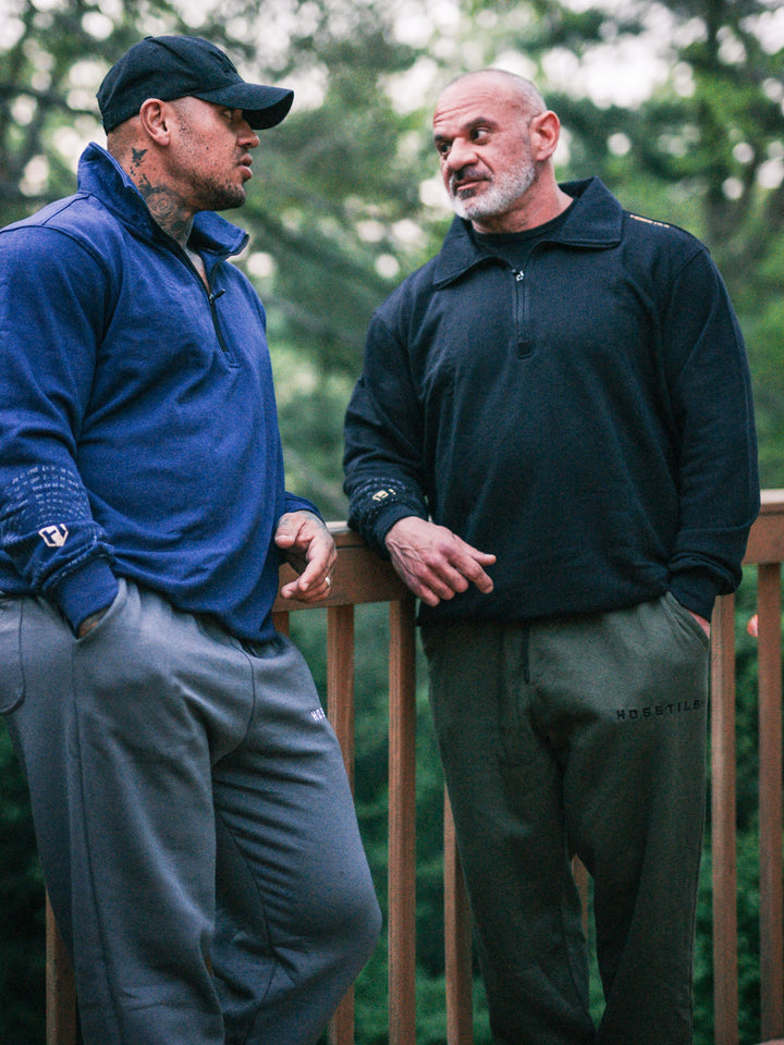 Bodybuilder wearing the Hosstile Straight Leg Jogger#color_military-green