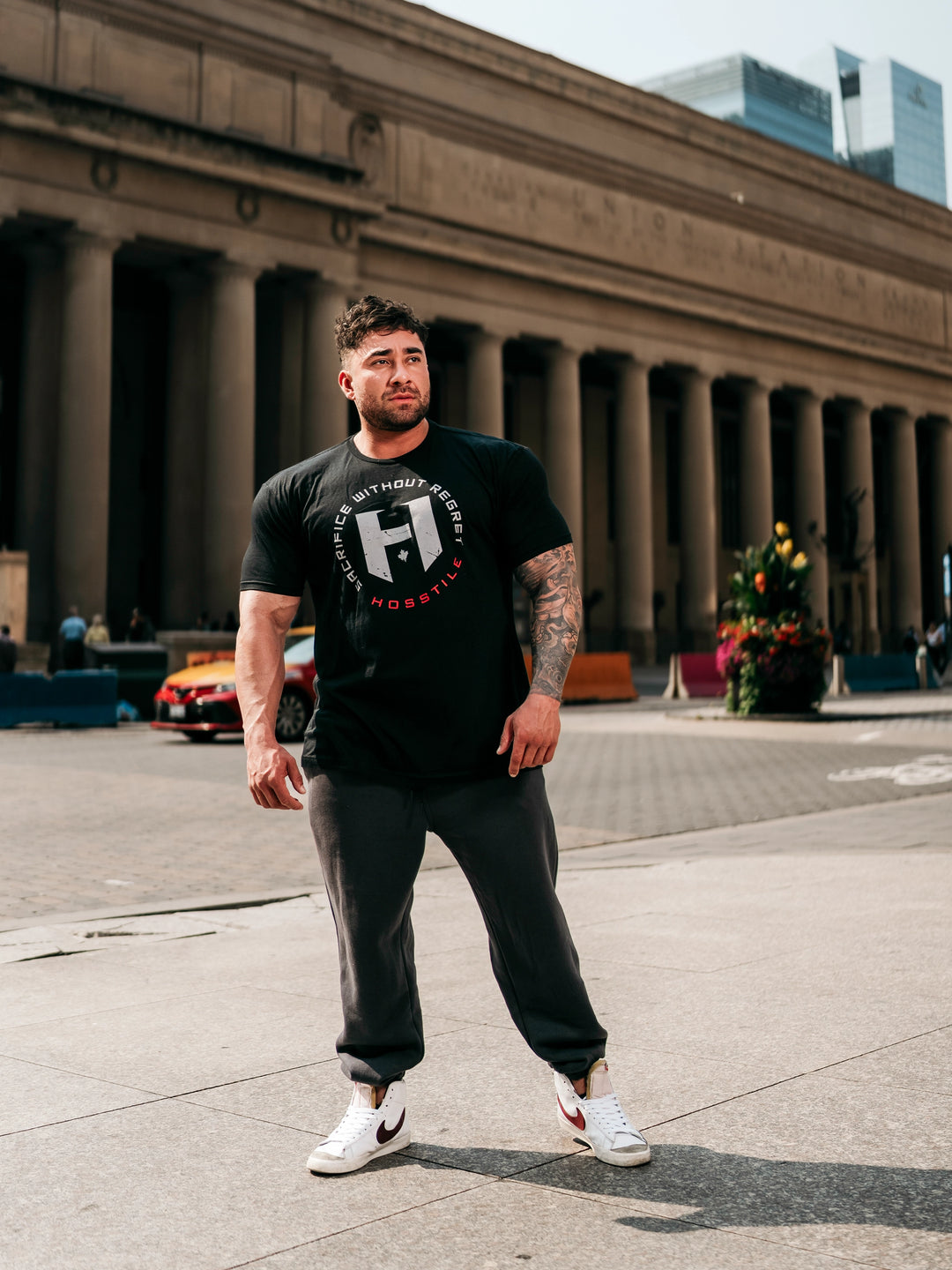 Bodybuilder wearing OG Sacrifice Classic Workout T-Shirt#color_black