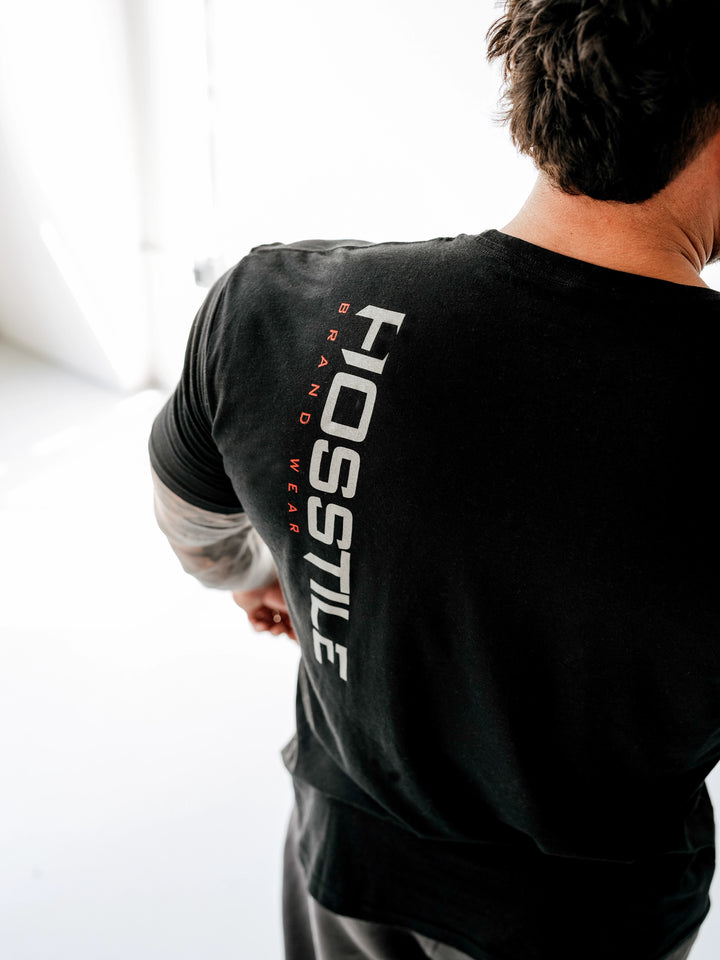 Bodybuilder wearing OG Sacrifice Classic Workout T-Shirt#color_black