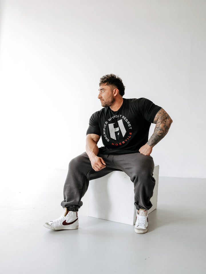 Bodybuilder wearing OG Sacrifice Classic Workout T-Shirt#color_black