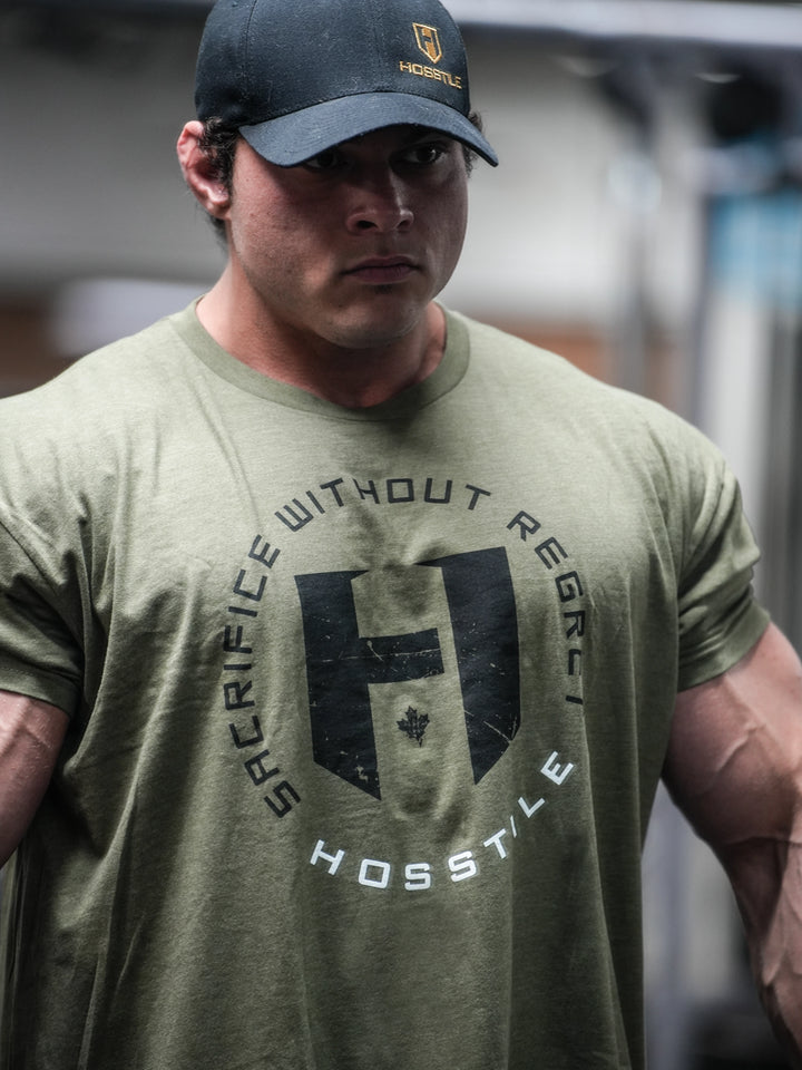 Bodybuilder wearing OG Sacrifice Classic Workout T-Shirt#color_military-green
