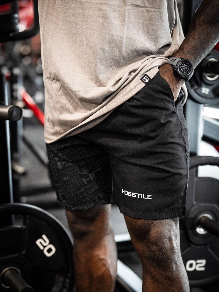 Bodybuilder Wearing Phantom Training Shorts#color_black