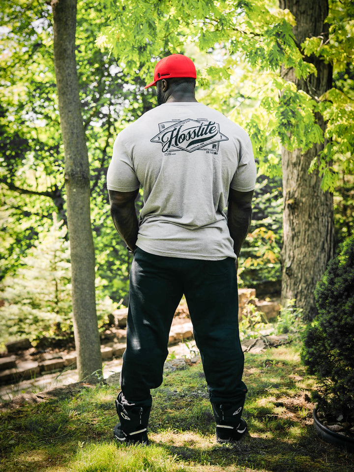 Bodybuilder wearing the Retro Select Workout T-shirt#color_heather-grey