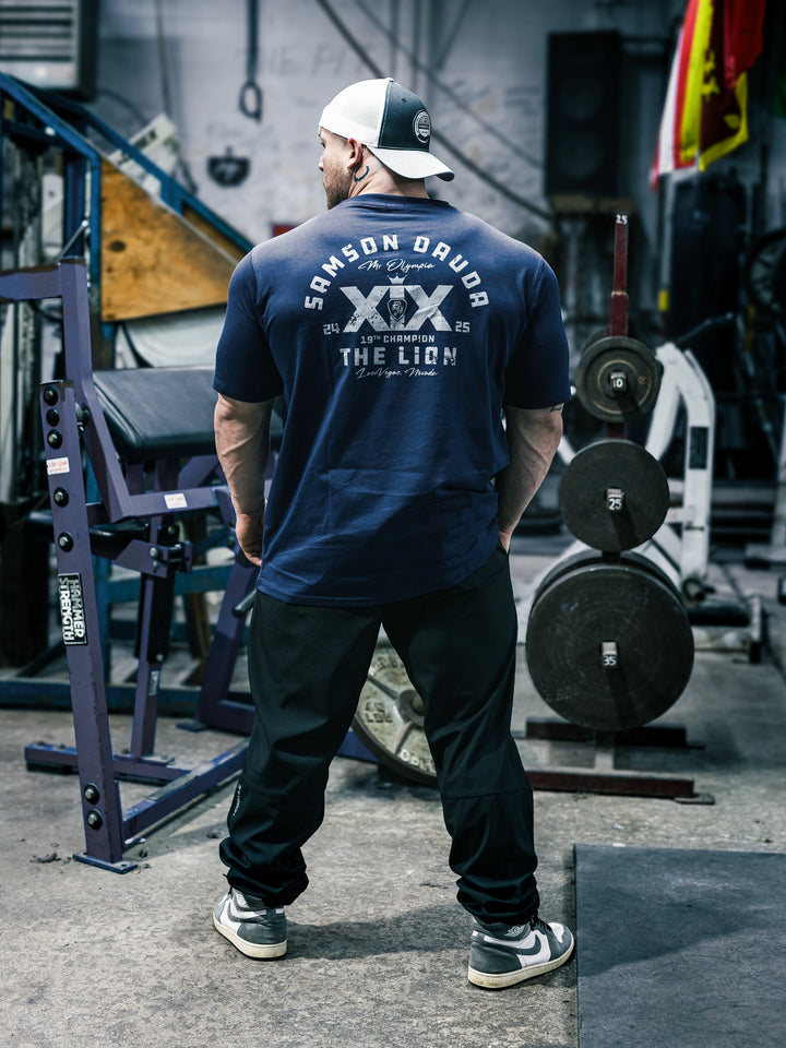 Bodybuilder Martin Fitzwater wearing the Samson Dauda Olympia Edition Vintage T-Shirts#color_pacific-blue