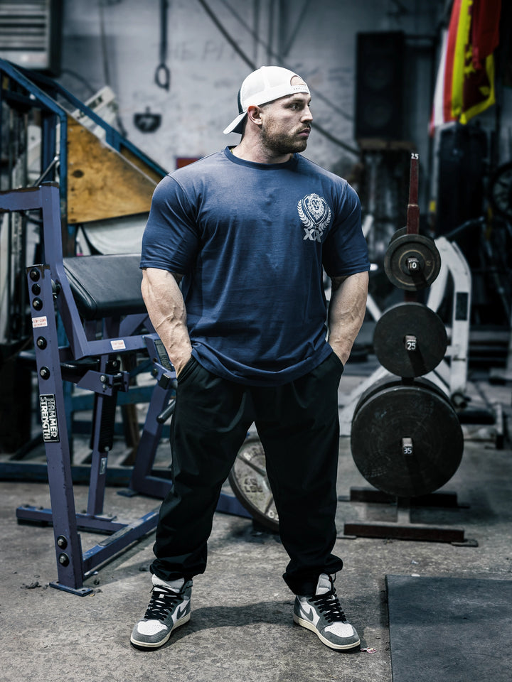 Bodybuilder Martin Fitzwater wearing the Samson Dauda Olympia Edition Vintage T-Shirts#color_pacific-blue