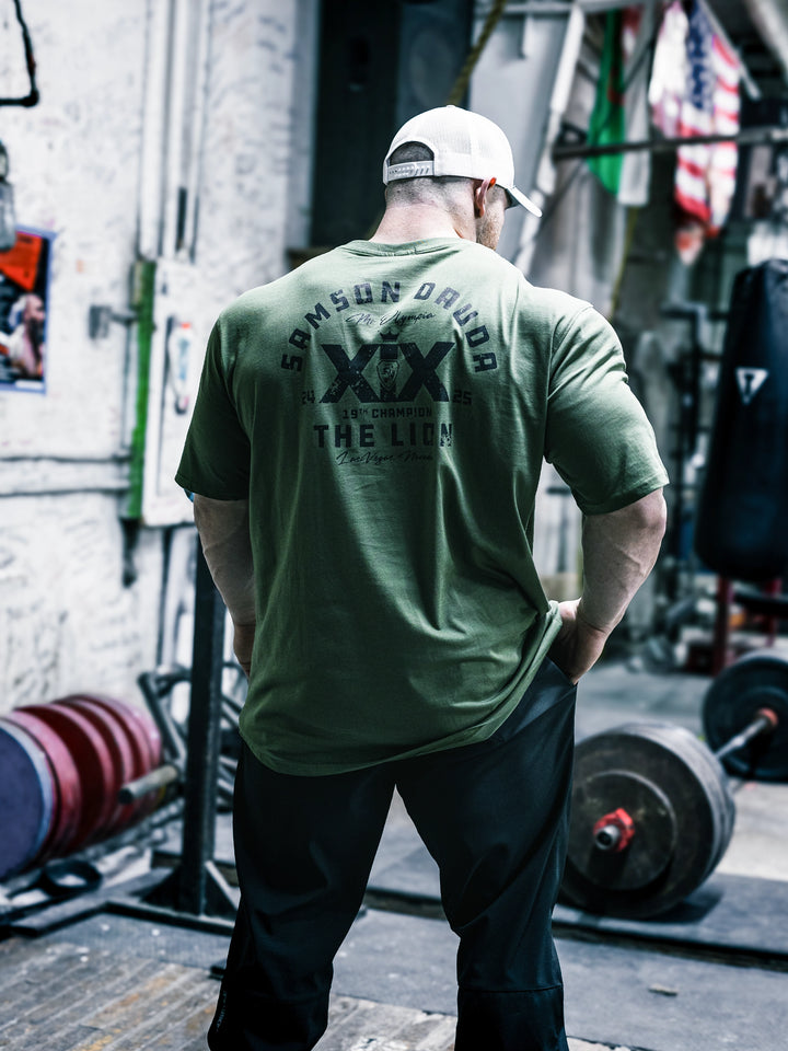 Bodybuilder Martin Fitzwater wearing the Samson Dauda Olympia Edition Vintage T-Shirts#color_light-olive