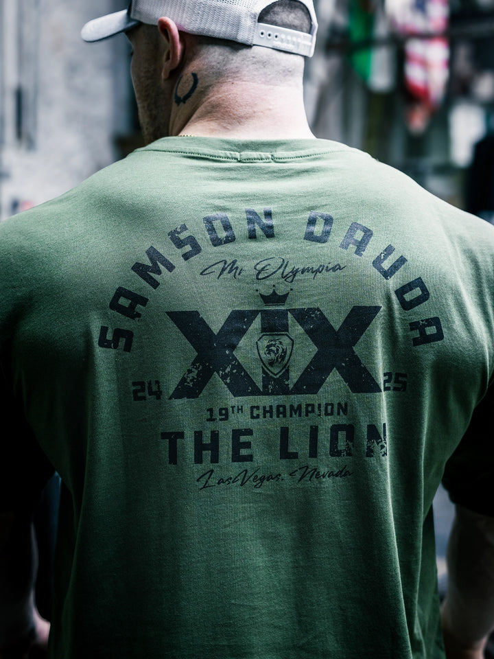 Bodybuilder Martin Fitzwater wearing the Samson Dauda Olympia Edition Vintage T-Shirts#color_light-olive