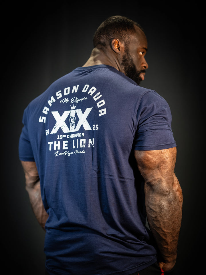 Bodybuilder Samson Dauda wearing the Samson Dauda Olympia Edition Vintage T-Shirts#color_pacific-blue