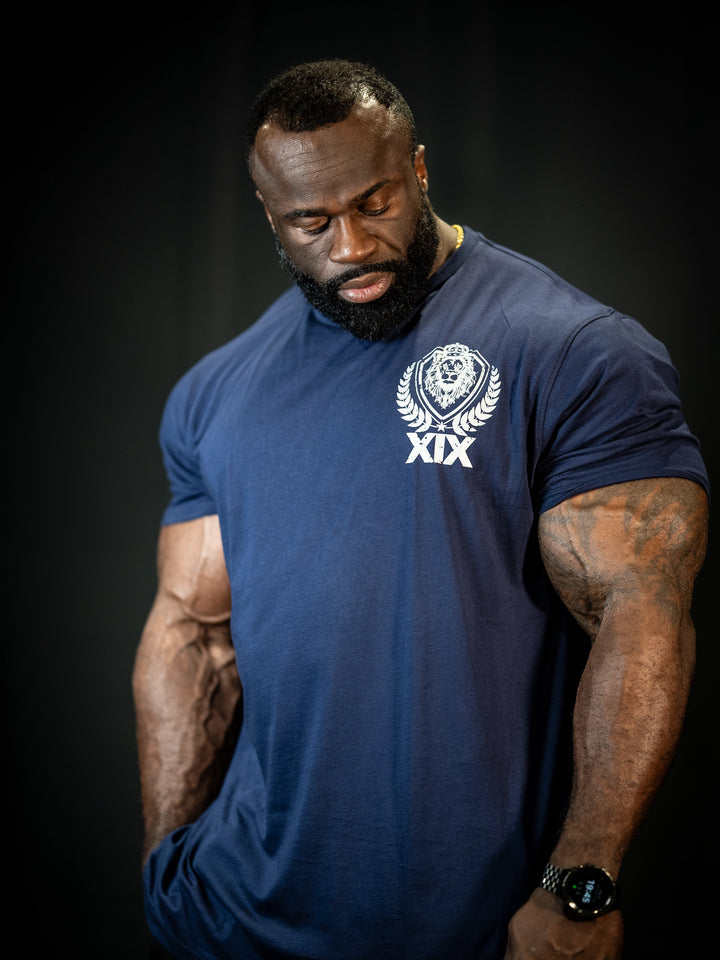 Bodybuilder Samson Dauda wearing the Samson Dauda Olympia Edition Vintage T-Shirts#color_pacific-blue
