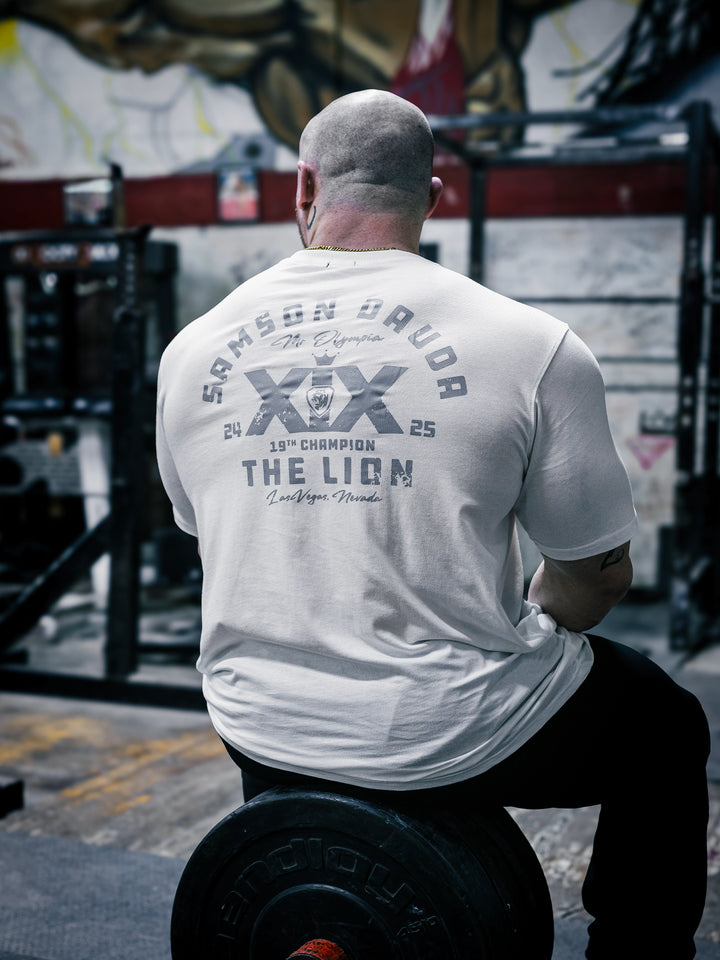 Bodybuilder Martin Fitzwater wearing the Samson Dauda Olympia Edition Vintage T-Shirts#color_off-white