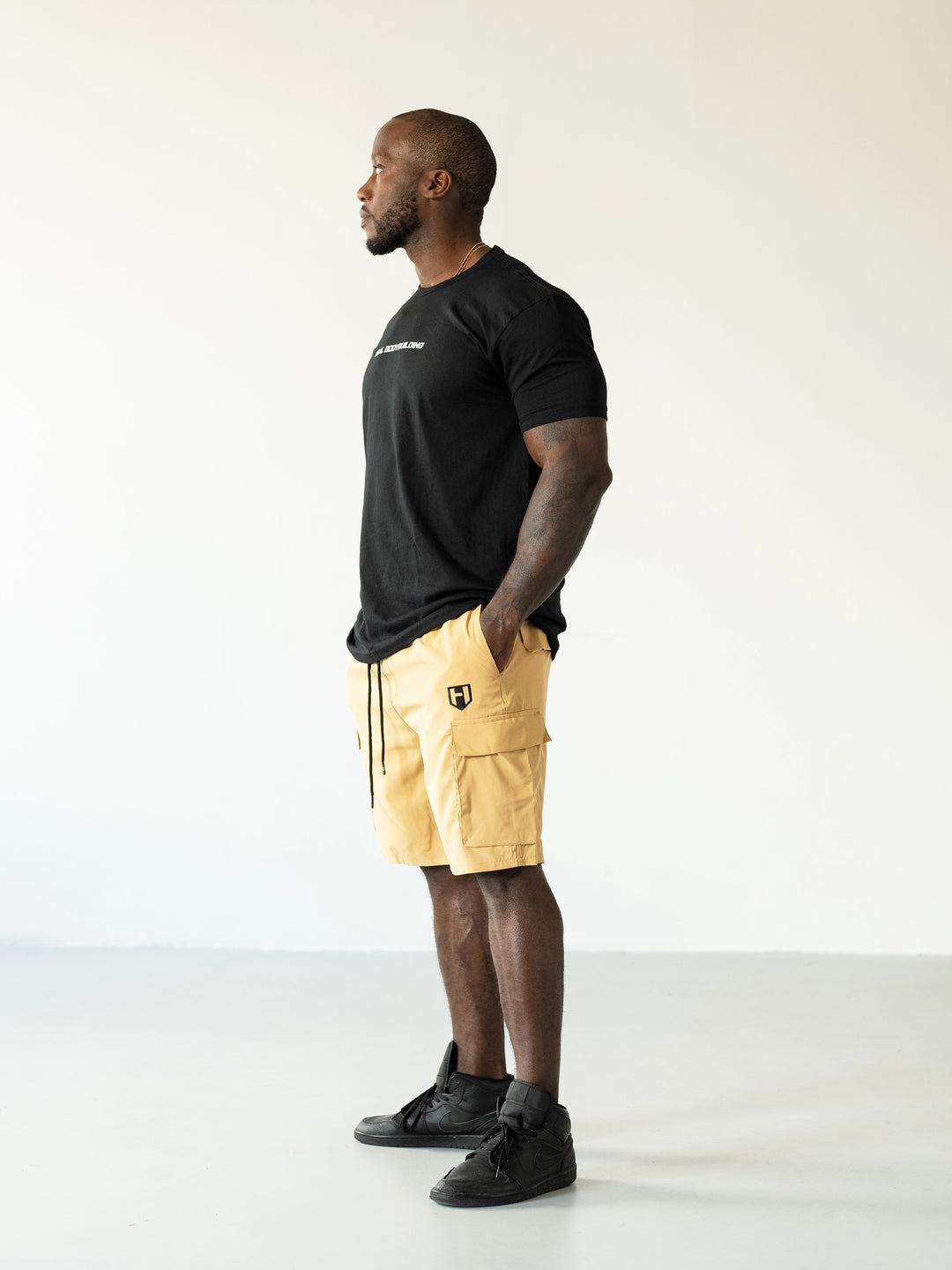 Bodybuilder Wearing Shield Gym Cargo Shorts - Caramel#color_caramel