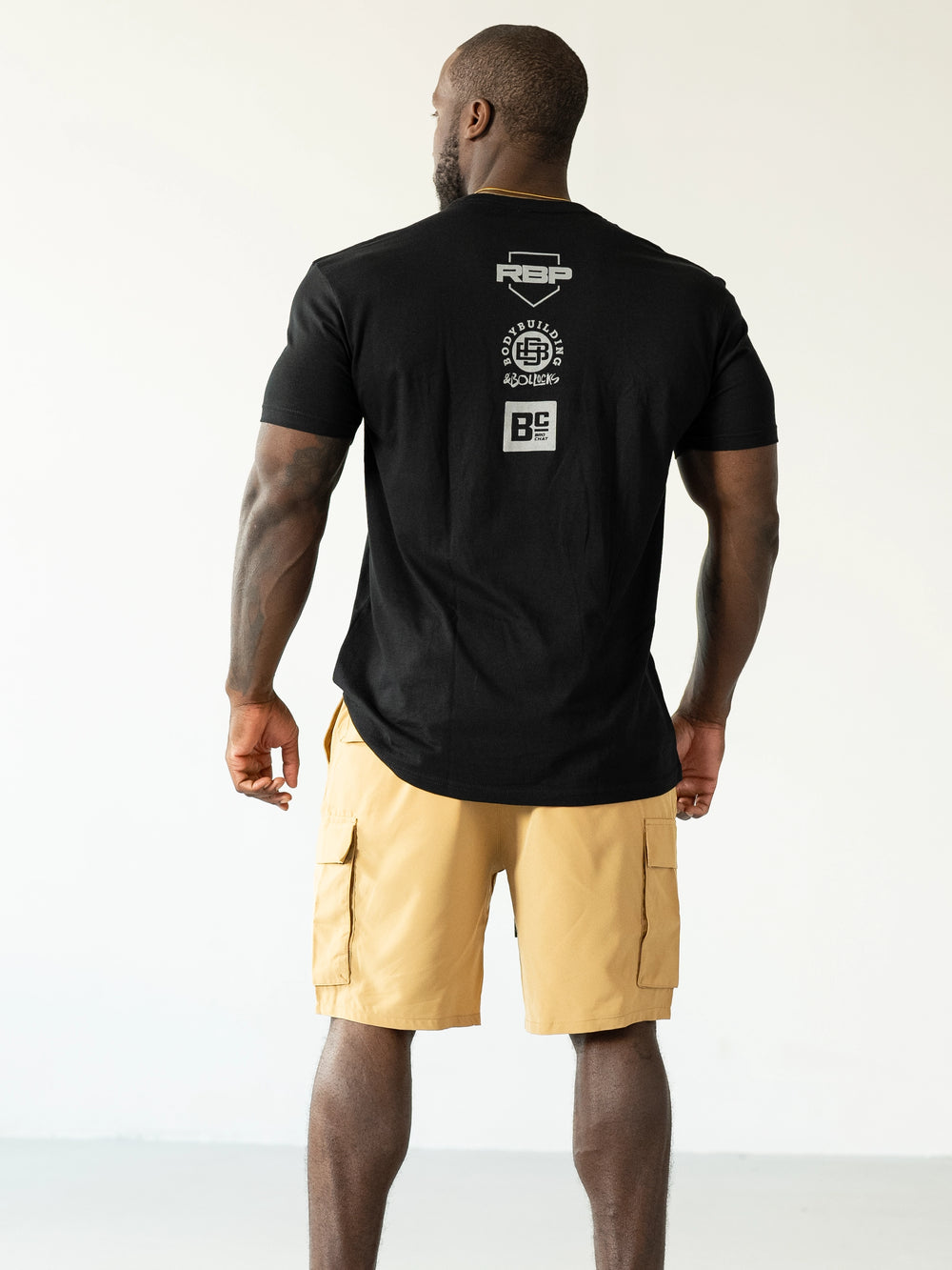 Bodybuilder Wearing Shield Gym Cargo Shorts - Caramel#color_caramel