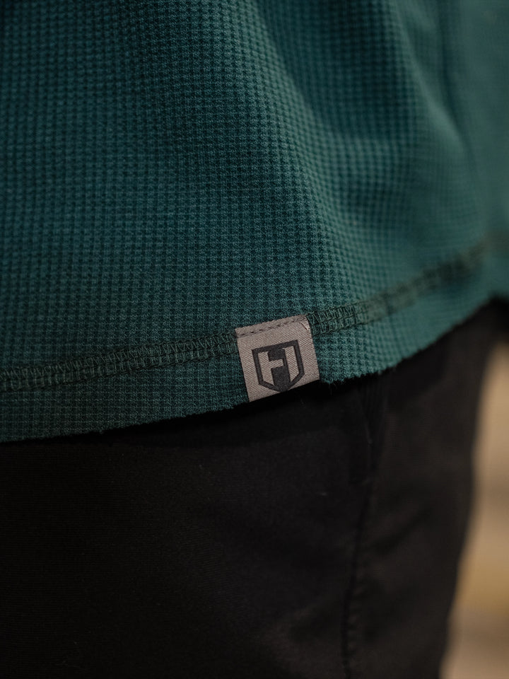 Bodybuilder wearing Shield Thermal Shirt#color_forest-green