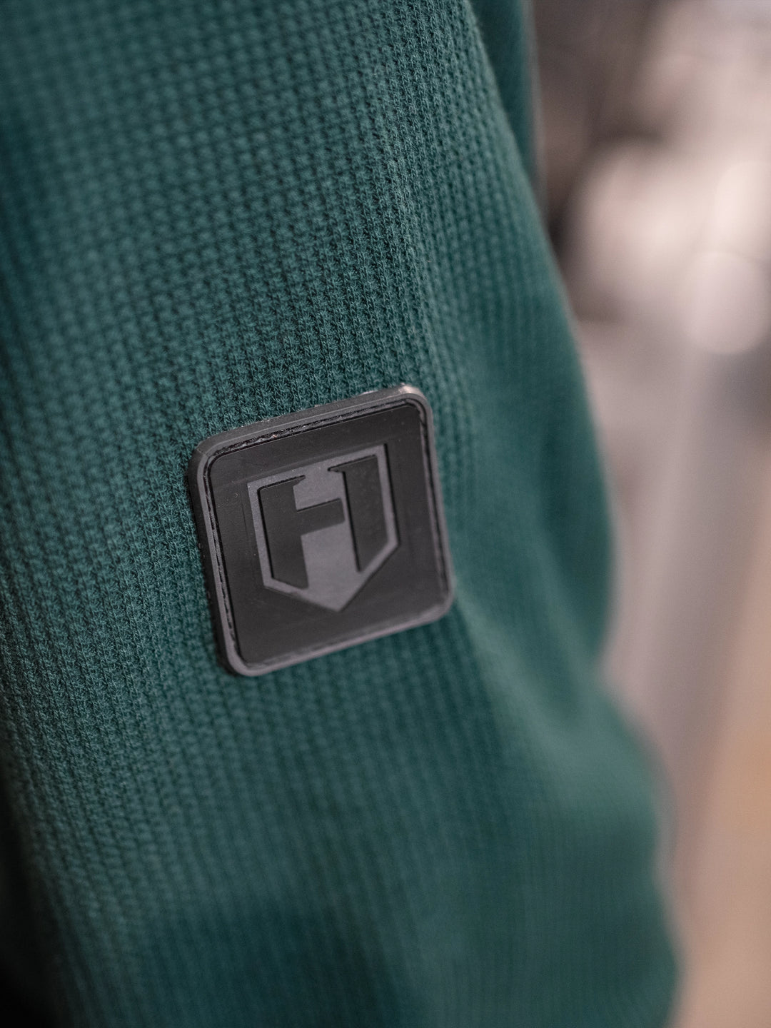 Bodybuilder wearing Shield Thermal Shirt#color_forest-green