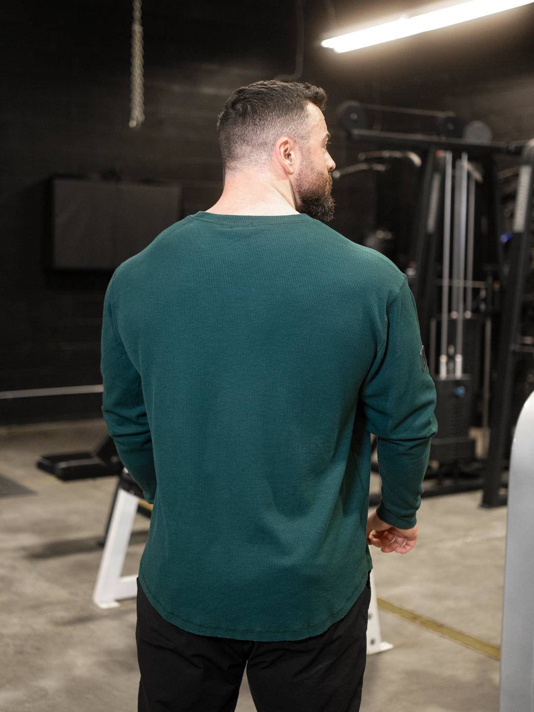 Bodybuilder wearing Shield Thermal Shirt#color_forest-green