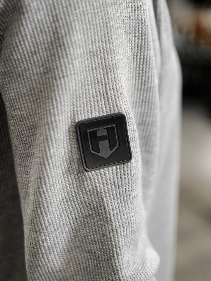 Fitness model wearing Shield Thermal Shirt#color_athletic-heather-grey