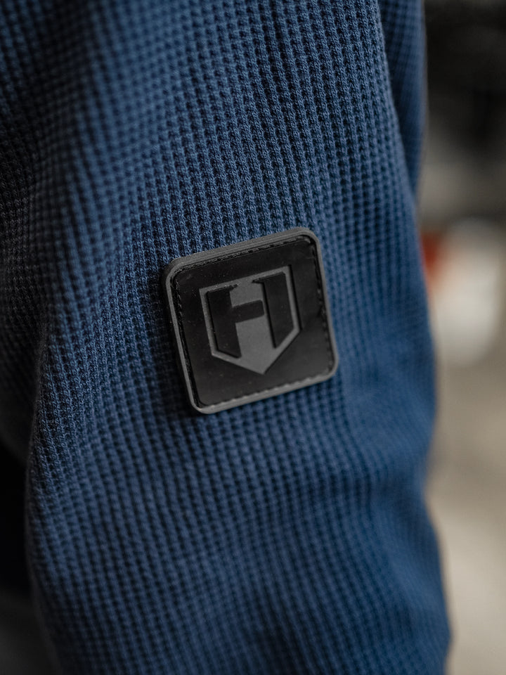 Fitness model wearing Shield Thermal Shirt#color_steel-blue