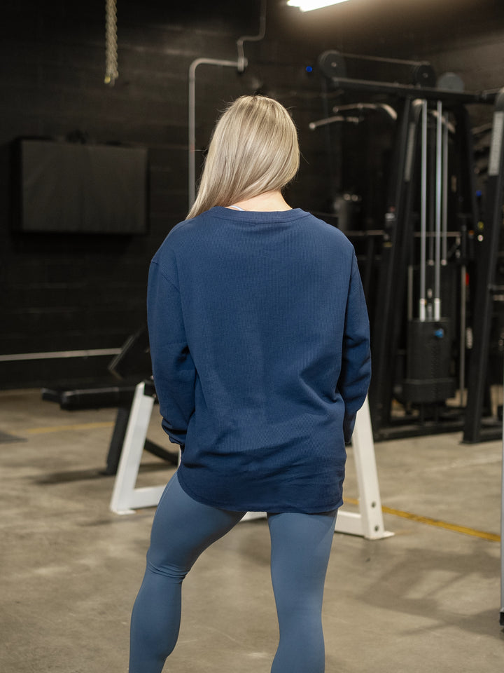 Fitness model wearing Shield Thermal Shirt#color_steel-blue