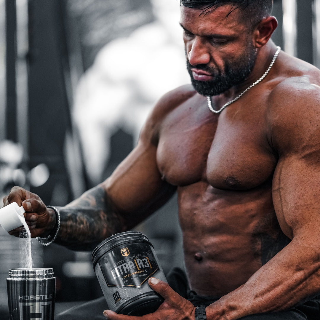 Bodybuilder Neil Currey scooping intra-workout into shaker cup