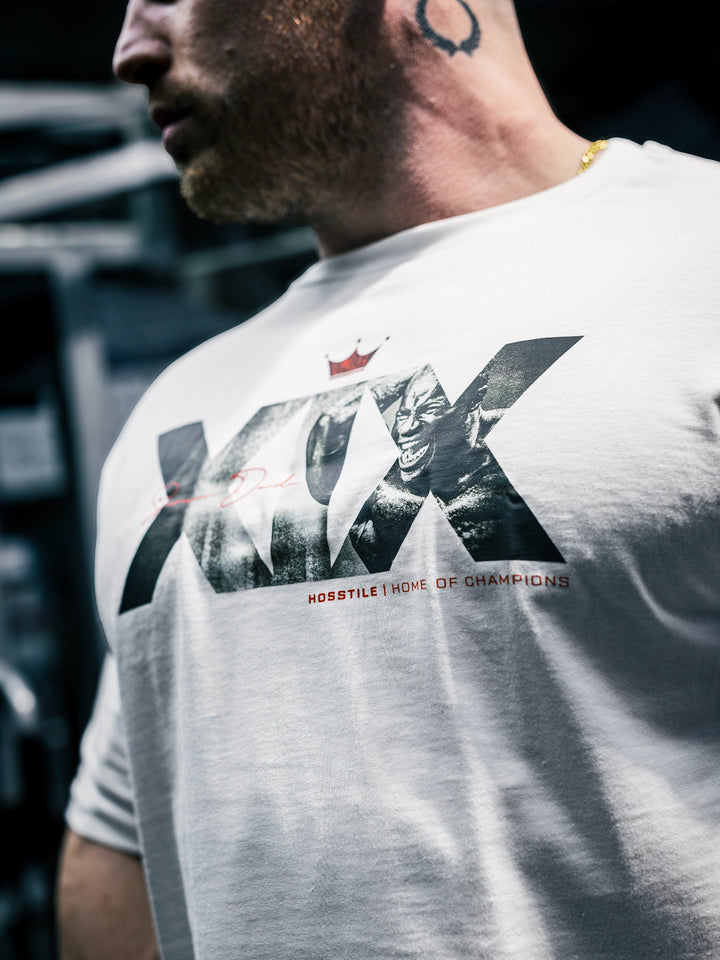 Bodybuilder Martin Fitzwater wearing the Mr. Olympia #19 Samson Dauda t-shirt in the gym#color_white