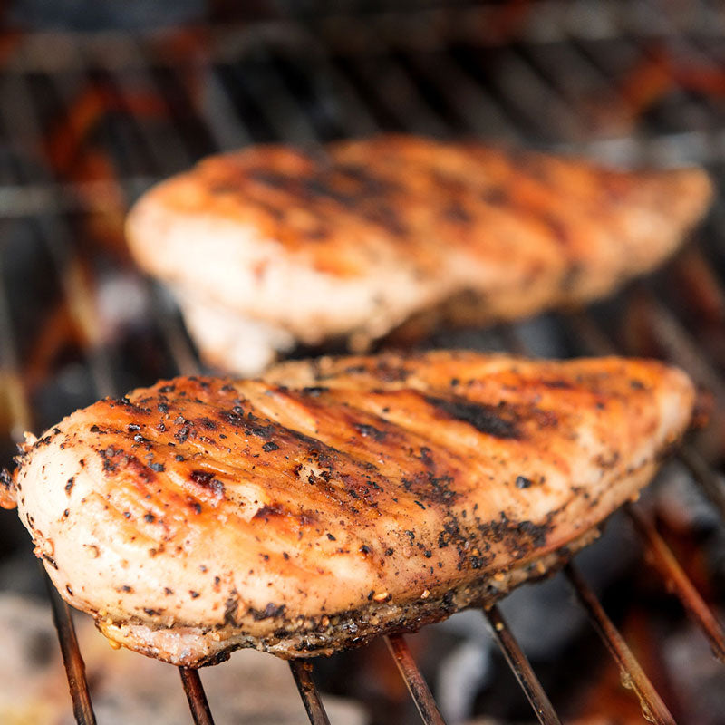 Chicken breasts grilling on the barbecue