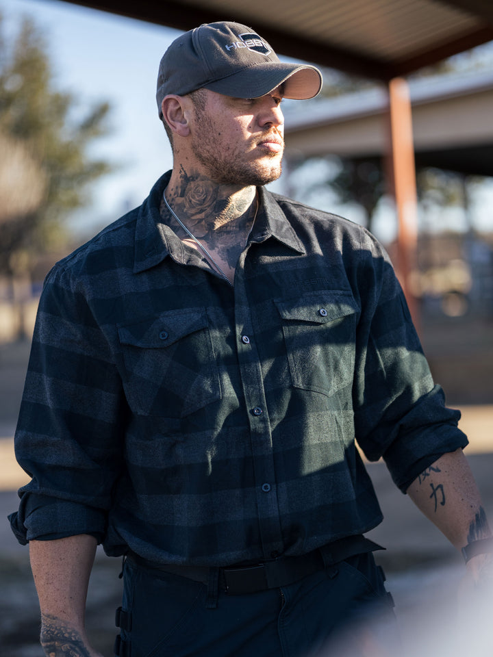 Hosstile Shield Long Sleeve Plaid Flannel Button Down Shirt Model Ben Chow#color_charcoal-black