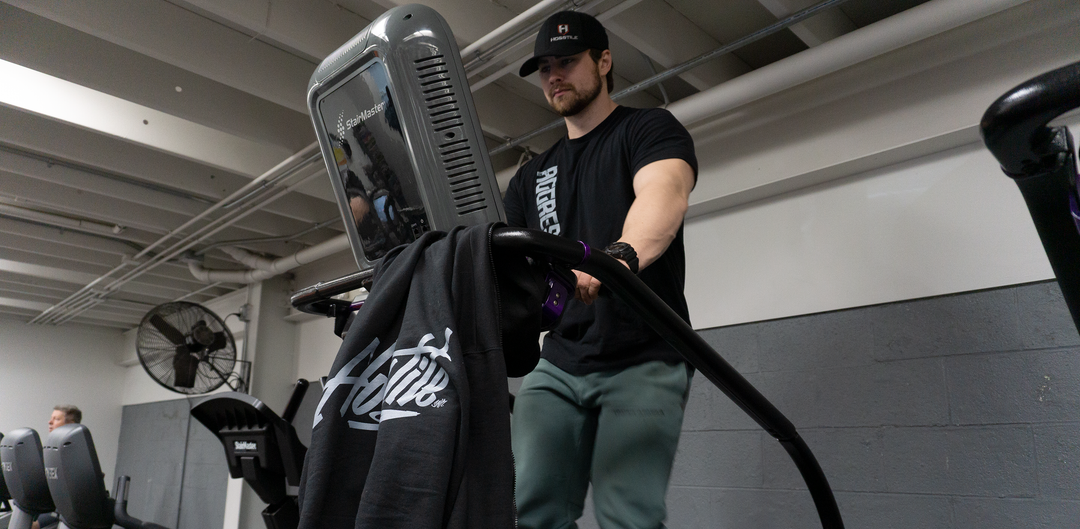 Bodybuilder doing cardio on a stairmaster machine
