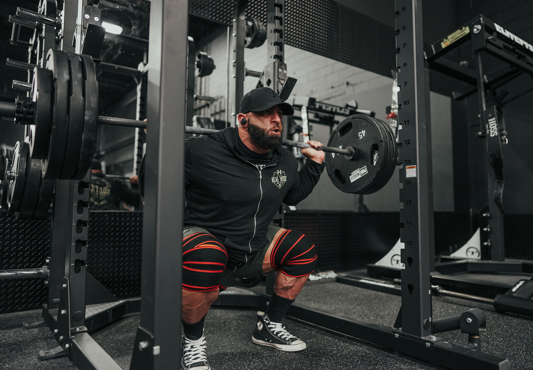 Bodybuilder Fouad Abiad squatting heavy weight