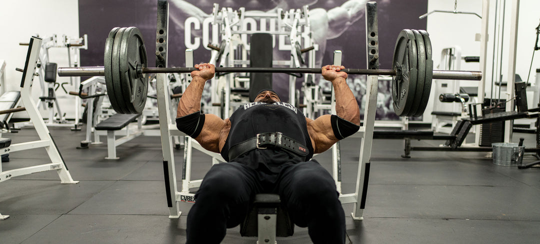 Bodybuilder Fouad Abiad bench pressing in the gym