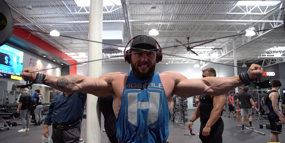 IFBB Pro bodybuilder Nathan Epler training shoulders in the gym