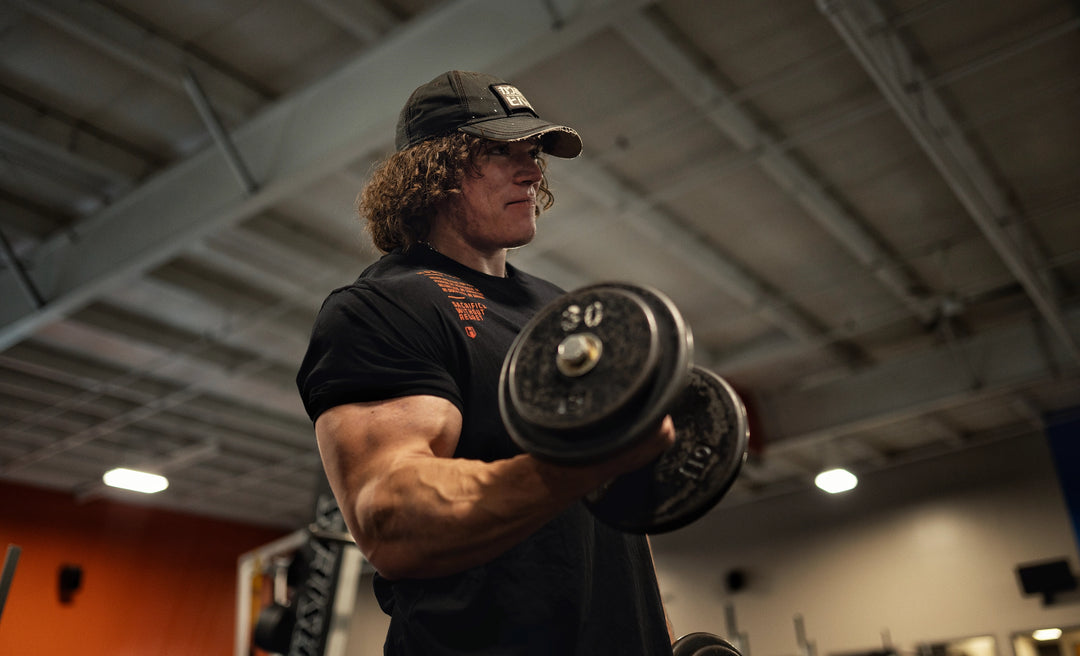 Sam Sulek training arms in the gym