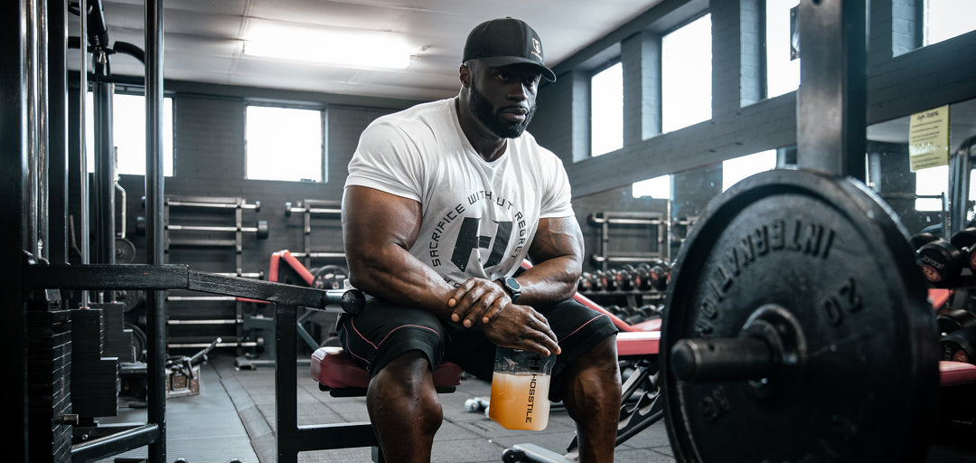 Bodybuilder Samson Dauda drinking his intra-workout supplement