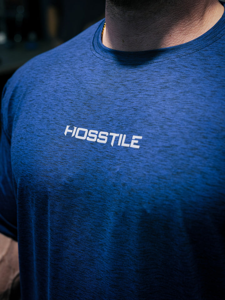 Bodybuilder Martin Fitzwater wearing the Hosstile Athletic Tee in the gym#color_steel-blue