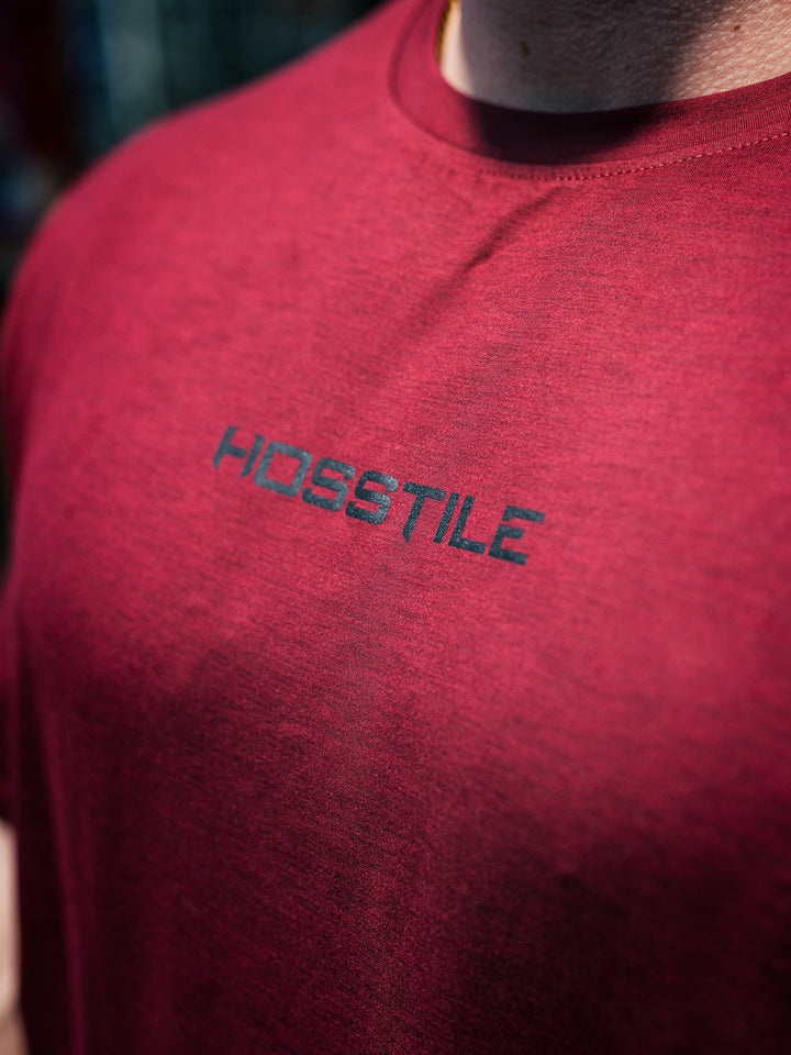 Bodybuilder Martin Fitzwater wearing the Hosstile Athletic Tee in the gym#color_flat-red