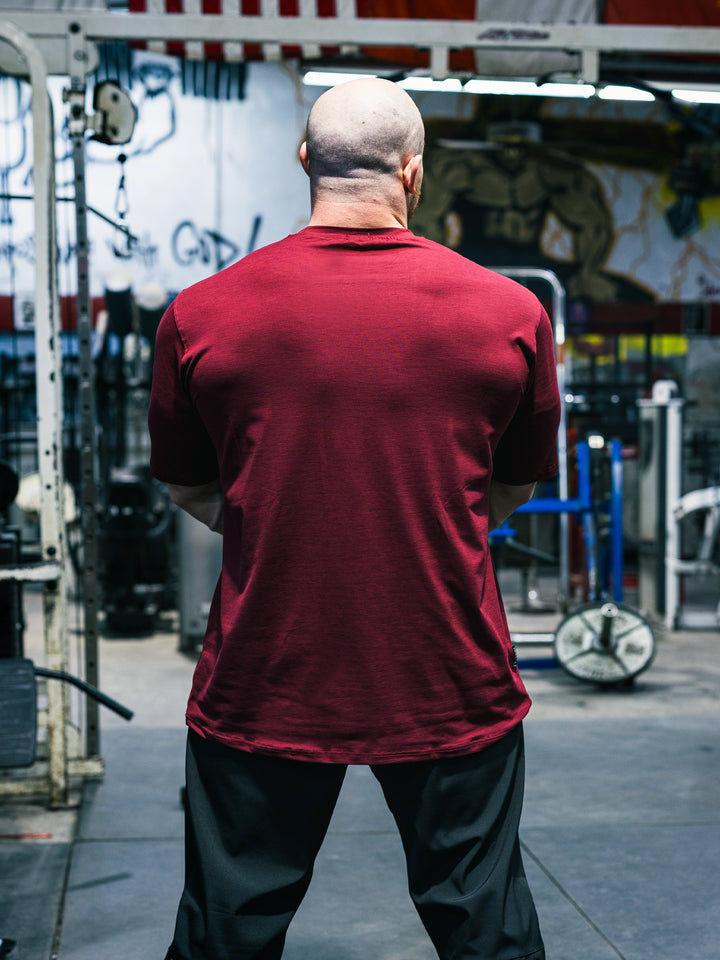 Bodybuilder Martin Fitzwater wearing the Hosstile Athletic Tee in the gym#color_flat-red